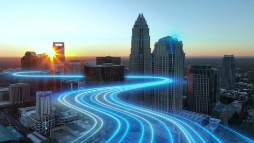 image of a city with a light-made road, signifying digital mobility